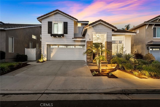 42 Beech Dr, Aliso Viejo, CA 92656 - view of front of house featuring concrete driveway, an attached garage, and a tile roof
