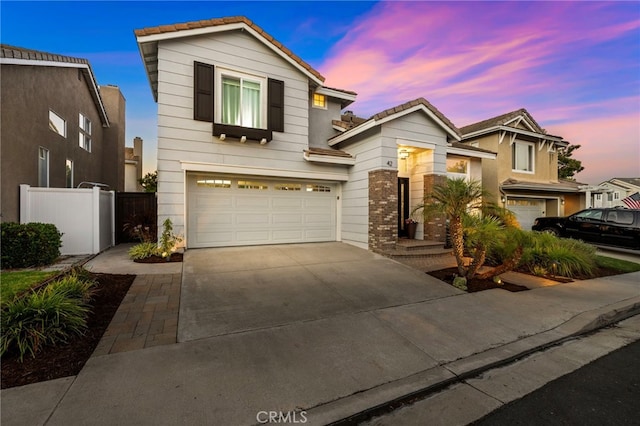 42 Beech Dr, Aliso Viejo, CA 92656 - traditional home with concrete driveway, a garage, and a tile roof