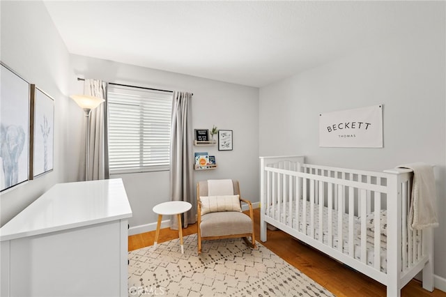 42 Beech Dr, Aliso Viejo, CA 92656 - bedroom featuring light wood-style flooring and a crib