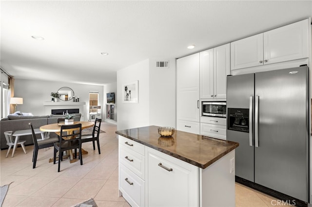 42 Beech Dr, Aliso Viejo, CA 92656 - kitchen featuring stainless steel appliances, dark countertops, white cabinets, and recessed lighting