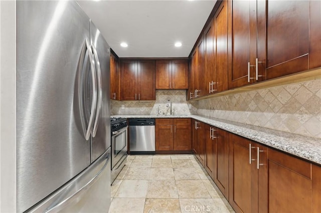 500 Jackson Pl Unit 118, Glendale, CA 91206 - kitchen featuring appliances with stainless steel finishes, recessed lighting, light stone countertops, and decorative backsplash