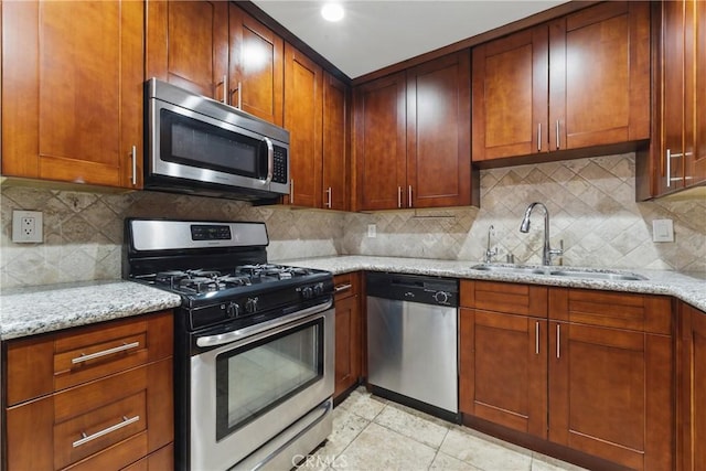 500 Jackson Pl Unit 118, Glendale, CA 91206 - kitchen featuring stainless steel appliances, light stone counters, and backsplash