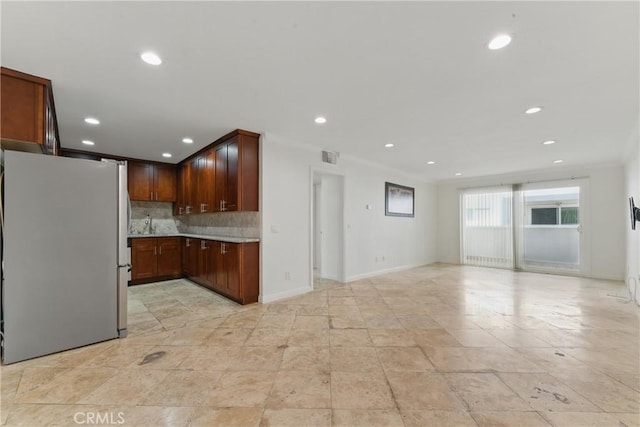 500 Jackson Pl Unit 118, Glendale, CA 91206 - kitchen featuring freestanding refrigerator, recessed lighting, light countertops, backsplash, and open floor plan