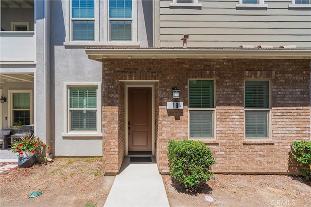 18 Jaripol Cir, Rancho Mission Viejo, CA 92694 - doorway to property featuring brick siding