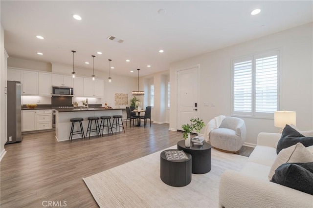 18 Jaripol Cir, Rancho Mission Viejo, CA 92694 - living area featuring light wood-style flooring and recessed lighting