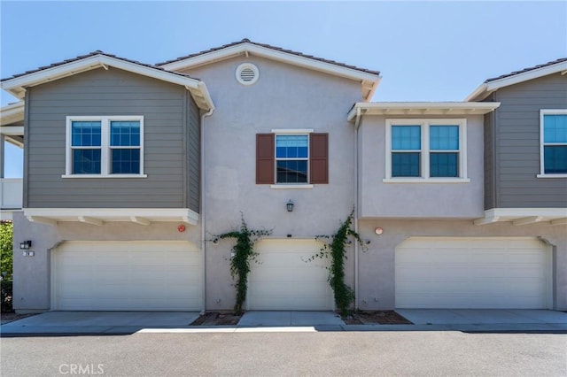 18 Jaripol Cir, Rancho Mission Viejo, CA 92694 - townhome / multi-family property featuring stucco siding and a garage