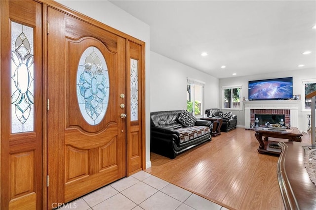 20623 Russ Jay St, Saugus, CA 91350 - entryway featuring recessed lighting, a fireplace, and light tile patterned flooring