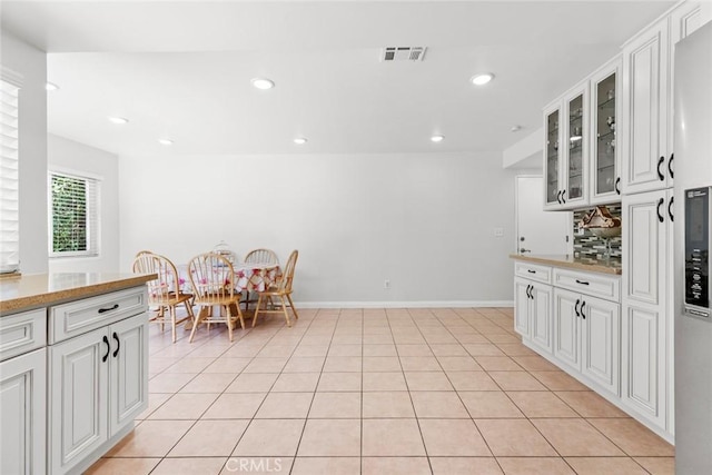 20623 Russ Jay St, Saugus, CA 91350 - kitchen featuring glass insert cabinets, white cabinetry, backsplash, recessed lighting, and light countertops