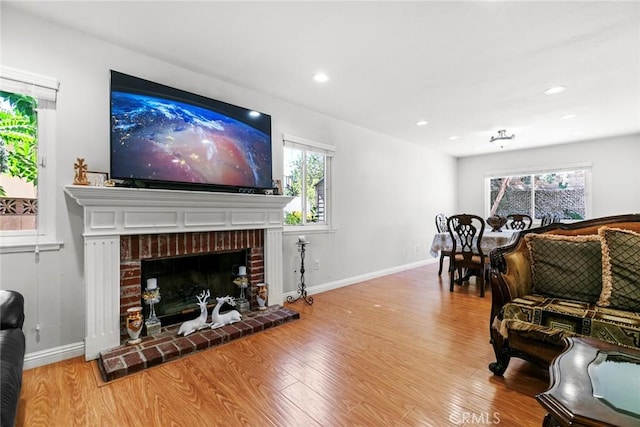 20623 Russ Jay St, Saugus, CA 91350 - living room featuring wood finished floors, plenty of natural light, recessed lighting, and a fireplace