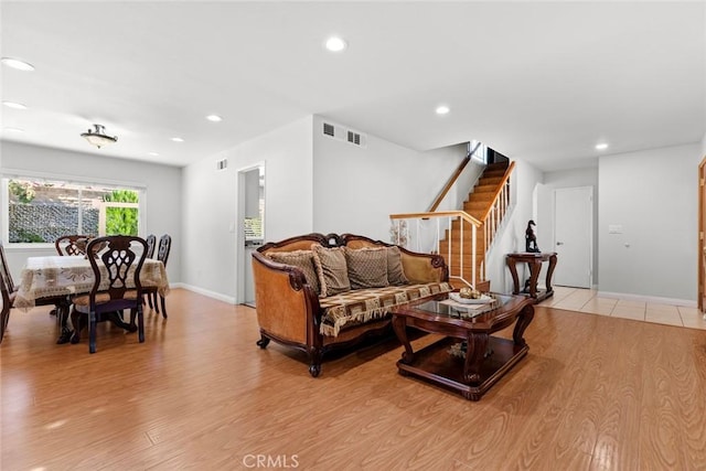 20623 Russ Jay St, Saugus, CA 91350 - living room featuring recessed lighting, stairway, and light wood-style flooring