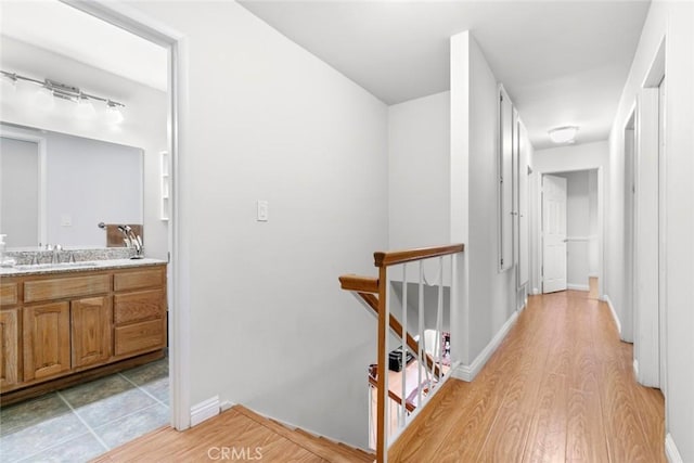 20623 Russ Jay St, Saugus, CA 91350 - corridor featuring an upstairs landing and light wood finished floors