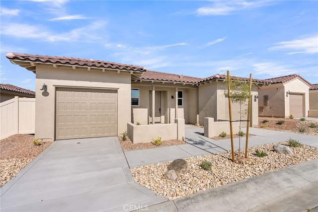 7420 Desert Sky Dr, Yucca Valley, CA 92284 - mediterranean / spanish home with driveway, a garage, stucco siding, and a tiled roof