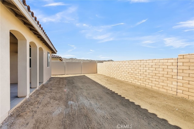 7420 Desert Sky Dr, Yucca Valley, CA 92284 - fenced backyard with a patio area
