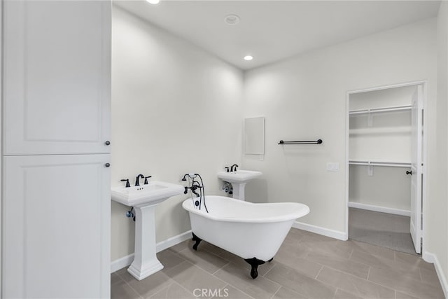 7420 Desert Sky Dr, Yucca Valley, CA 92284 - full bathroom featuring a freestanding tub, a walk in closet, and recessed lighting