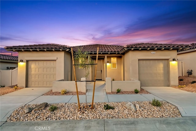 7420 Desert Sky Dr, Yucca Valley, CA 92284 - mediterranean / spanish home with a garage, concrete driveway, and stucco siding