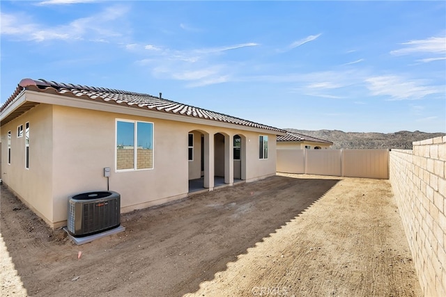 7420 Desert Sky Dr, Yucca Valley, CA 92284 - rear view of house featuring a tiled roof, stucco siding, and a patio