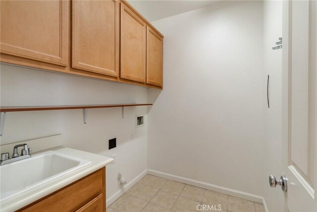 6631 Aggies Ct, Winton, CA 95388 - laundry room with cabinet space, hookup for a washing machine, and light tile patterned flooring