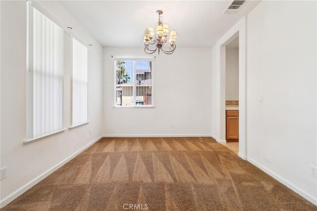6631 Aggies Ct, Winton, CA 95388 - carpeted empty room featuring a chandelier and baseboards