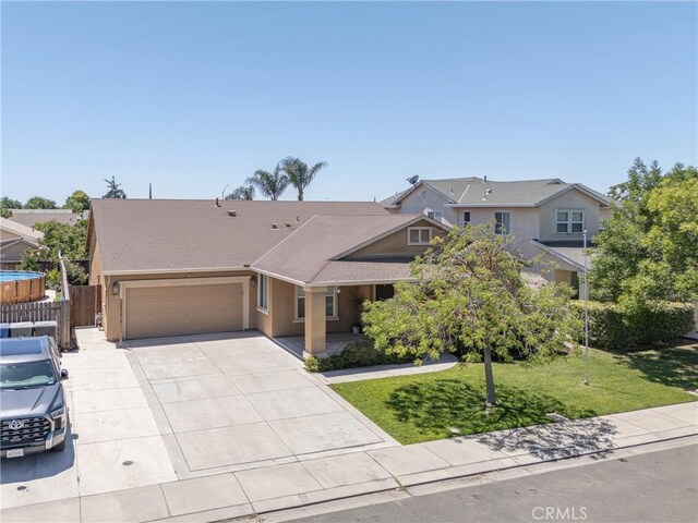 6631 Aggies Ct, Winton, CA 95388 - view of front of property featuring a garage, driveway, a shingled roof, and stucco siding