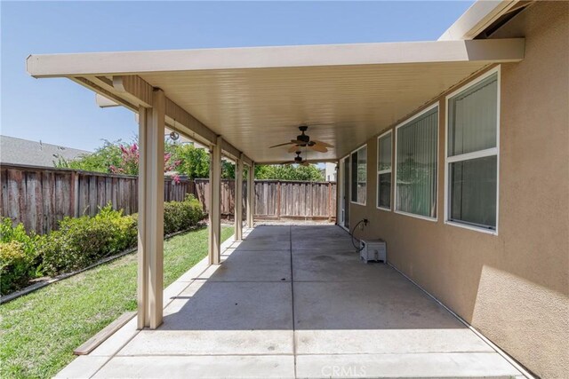 6631 Aggies Ct, Winton, CA 95388 - fenced backyard featuring ceiling fan and a patio