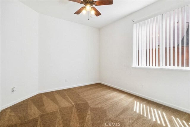 6631 Aggies Ct, Winton, CA 95388 - empty room with carpet floors and a ceiling fan
