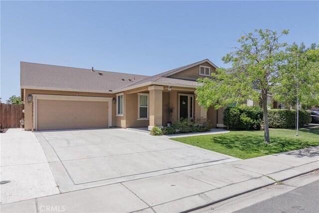 6631 Aggies Ct, Winton, CA 95388 - view of front facade with stucco siding, driveway, and an attached garage