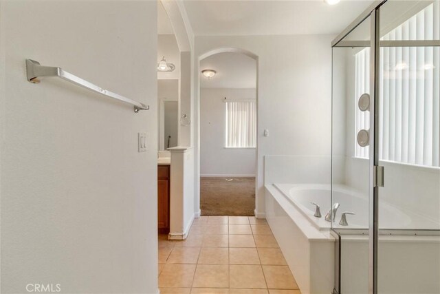 6631 Aggies Ct, Winton, CA 95388 - full bath with vanity, a bath, tile patterned flooring, and a shower stall
