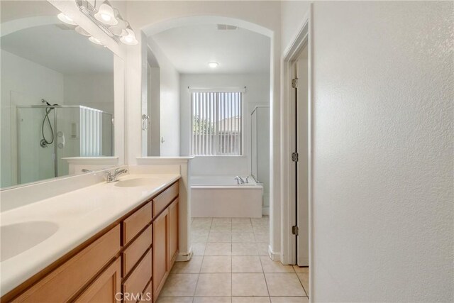 6631 Aggies Ct, Winton, CA 95388 - full bath with a shower stall, tile patterned flooring, a bath, and double vanity