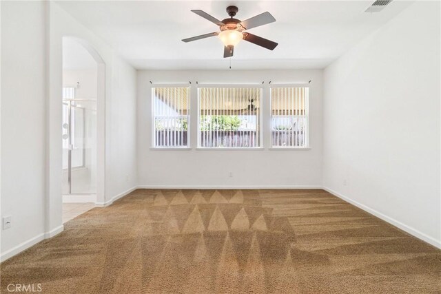 6631 Aggies Ct, Winton, CA 95388 - empty room featuring carpet floors, healthy amount of natural light, and a ceiling fan