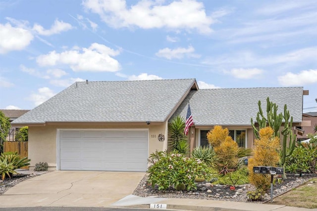 151 Camino Vista Real, Chula Vista, CA 91910 - view of front of house with stucco siding, concrete driveway, a garage, and roof with shingles