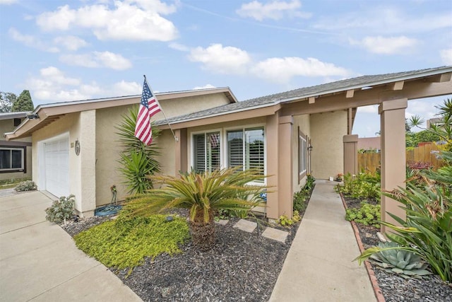 151 Camino Vista Real, Chula Vista, CA 91910 - view of side of home featuring stucco siding, an attached garage, and driveway