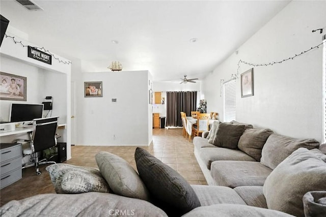 25780 Jumano Dr, Moreno Valley, CA 92551 - tiled living room with a desk and a ceiling fan