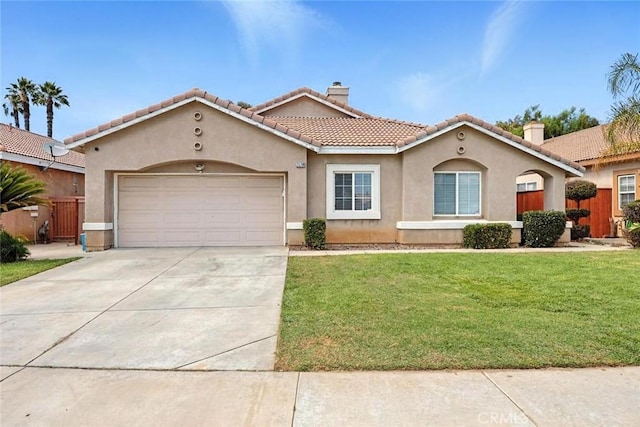 25780 Jumano Dr, Moreno Valley, CA 92551 - mediterranean / spanish-style house featuring a chimney, an attached garage, stucco siding, and concrete driveway