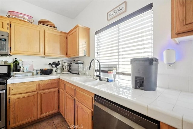 25780 Jumano Dr, Moreno Valley, CA 92551 - kitchen featuring appliances with stainless steel finishes, plenty of natural light, and light tile patterned floors