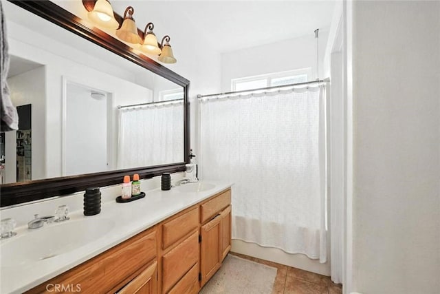 25780 Jumano Dr, Moreno Valley, CA 92551 - full bathroom featuring double vanity, shower / bath combo, and tile patterned flooring