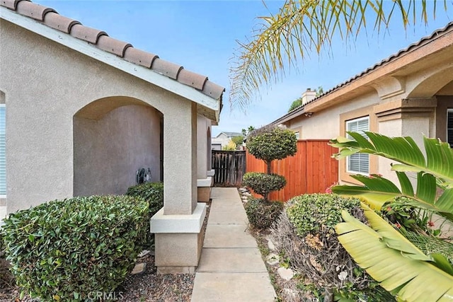 25780 Jumano Dr, Moreno Valley, CA 92551 - view of exterior entry with stucco siding and a tiled roof