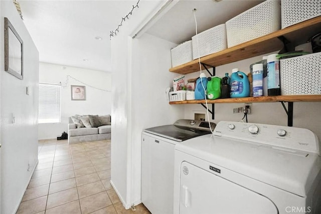 25780 Jumano Dr, Moreno Valley, CA 92551 - washroom featuring washer and dryer and light tile patterned floors
