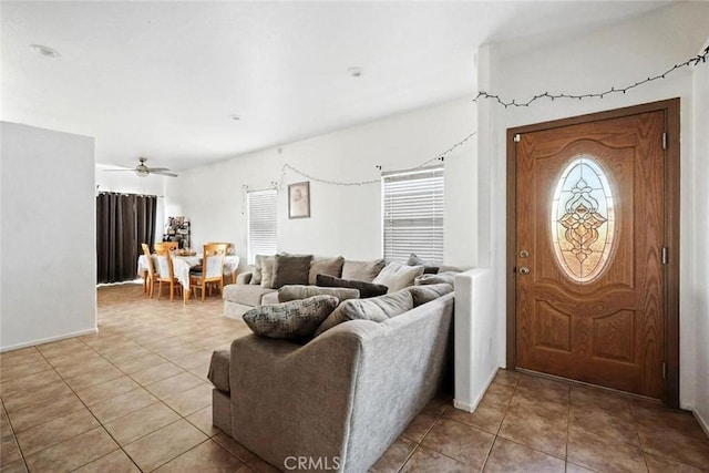 25780 Jumano Dr, Moreno Valley, CA 92551 - entryway featuring tile patterned floors, plenty of natural light, and ceiling fan