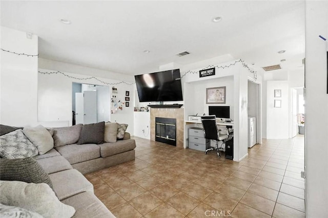 25780 Jumano Dr, Moreno Valley, CA 92551 - living room featuring a tile fireplace, an office area, and light tile patterned floors
