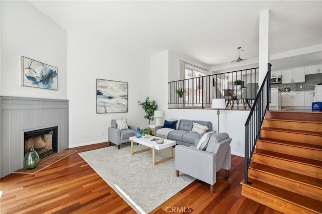 312 N Francisca Ave Unit 1, Redondo Beach, CA 90277 - living area with wood finished floors, stairs, and a fireplace with flush hearth