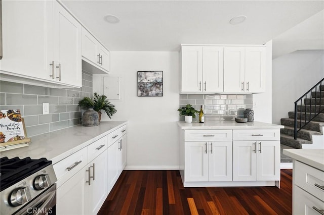 312 N Francisca Ave Unit 1, Redondo Beach, CA 90277 - kitchen with gas stove, dark wood-style floors, backsplash, and white cabinetry