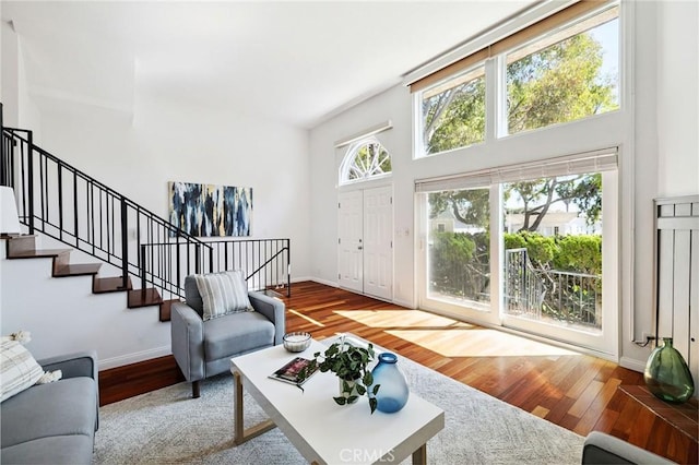 312 N Francisca Ave Unit 1, Redondo Beach, CA 90277 - living room with stairs, wood finished floors, and a towering ceiling