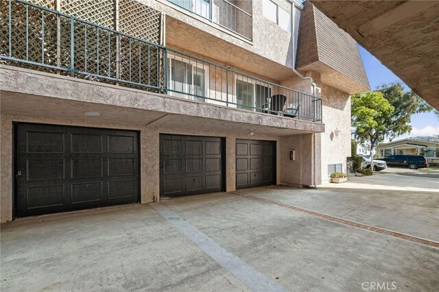 312 N Francisca Ave Unit 1, Redondo Beach, CA 90277 - view of building exterior with a garage and driveway