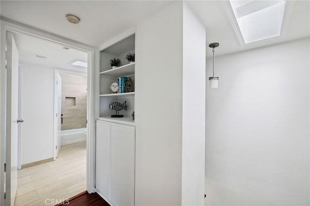 312 N Francisca Ave Unit 1, Redondo Beach, CA 90277 - hall featuring a skylight and wood finished floors