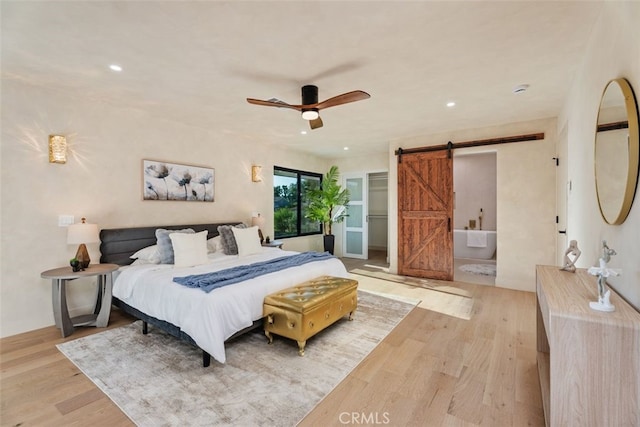 6032 Sun Knoll Cir, Yorba Linda, CA 92886 - bedroom with a barn door, wood finished floors, recessed lighting, and a ceiling fan