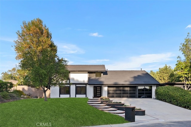 6032 Sun Knoll Cir, Yorba Linda, CA 92886 - view of front of property with concrete driveway, an attached garage, a front lawn, a tile roof, and stucco siding