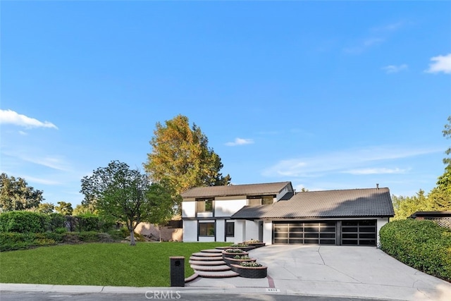 6032 Sun Knoll Cir, Yorba Linda, CA 92886 - view of front facade featuring a garage, driveway, a front lawn, a tiled roof, and stucco siding