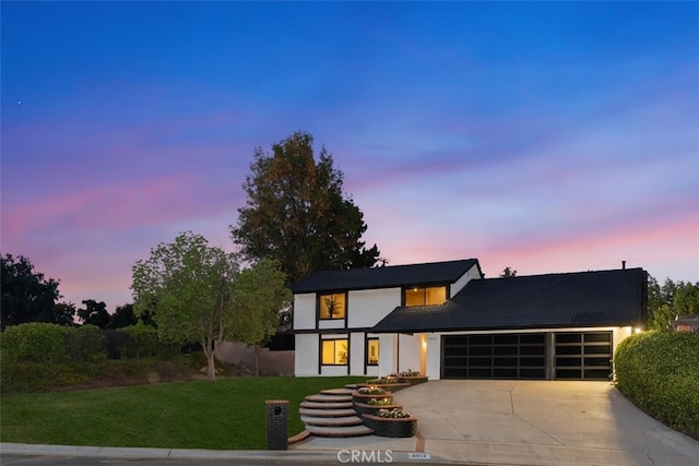 6032 Sun Knoll Cir, Yorba Linda, CA 92886 - view of front of house with an attached garage, concrete driveway, a yard, and stucco siding
