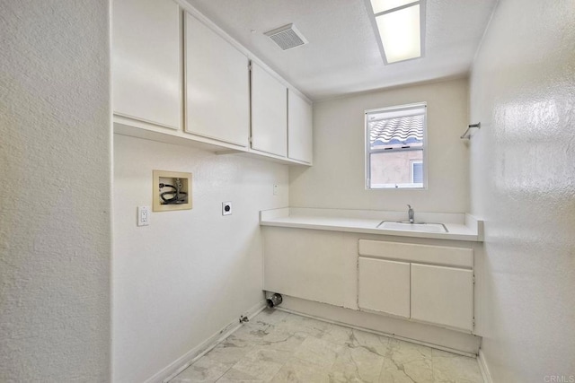 2053 Sequoia St, San Marcos, CA 92078 - laundry area with hookup for a washing machine, hookup for an electric dryer, light marble finish floors, hookup for a gas dryer, and cabinet space
