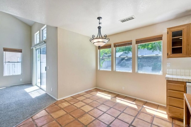 2053 Sequoia St, San Marcos, CA 92078 - unfurnished dining area with light carpet and light tile patterned flooring